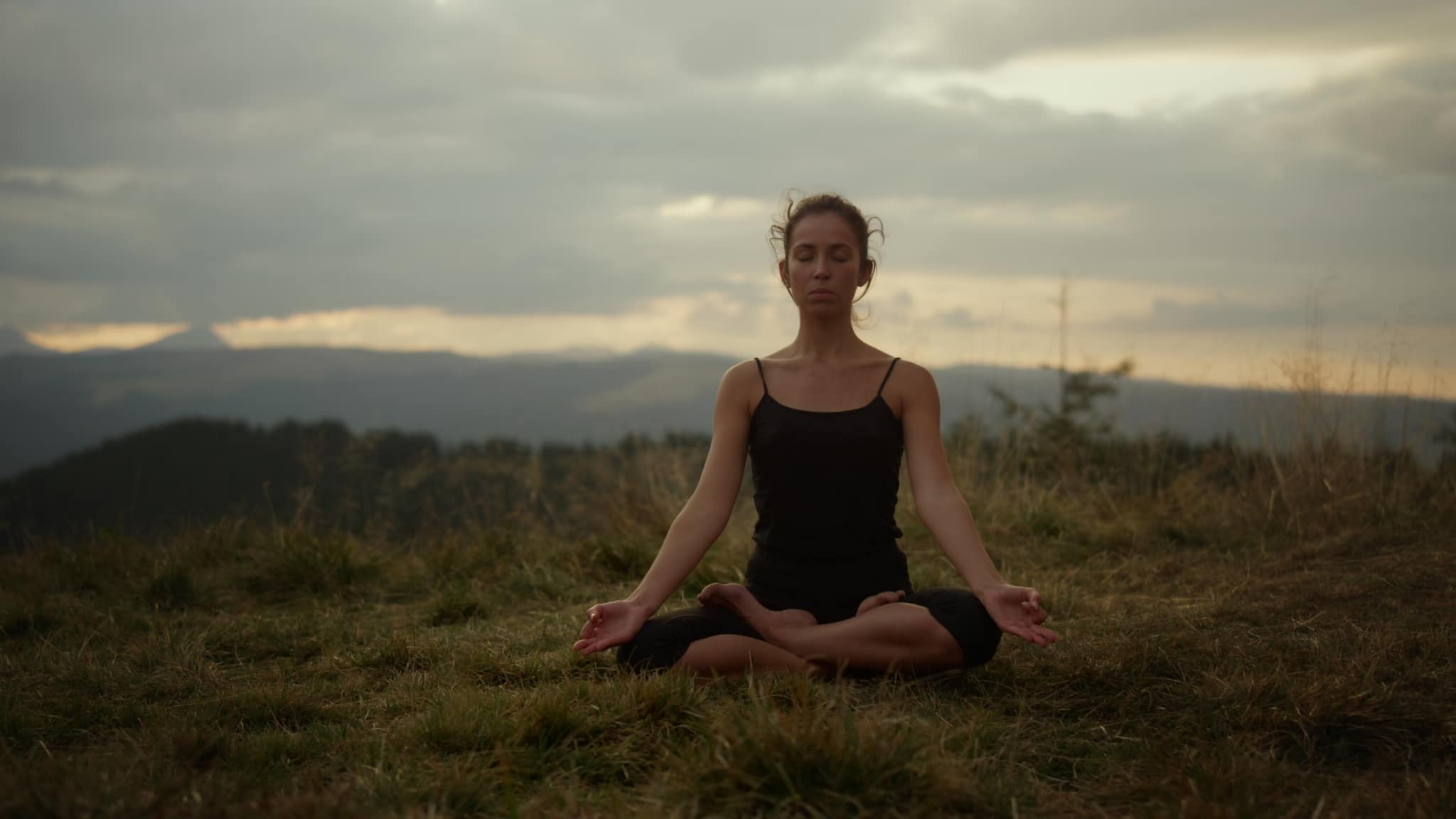 focused lady doing yoga and meditation